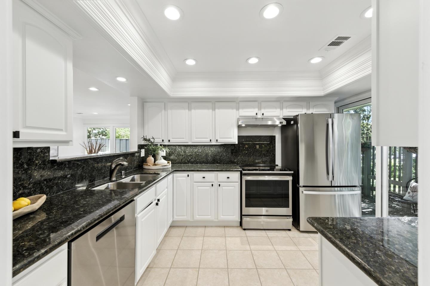 1 Los Altos Square Los Altos, CA 94022 - Photo 7 of 29 a kitchen with a sink stainless steel appliances and white cabinets