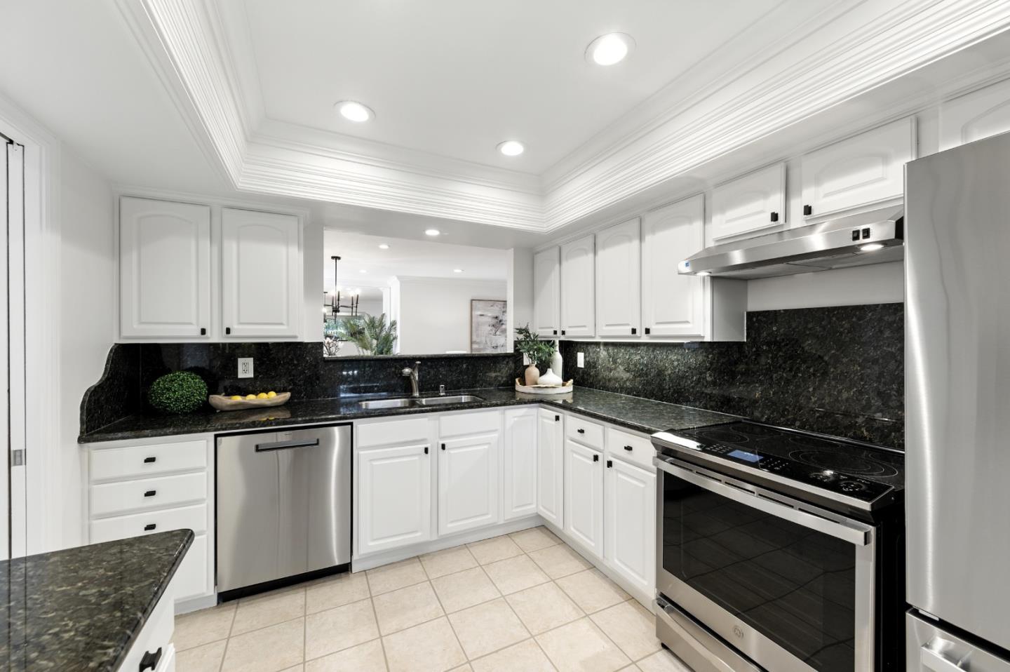 1 Los Altos Square Los Altos, CA 94022 - Photo 8 of 29 a kitchen with granite countertop a sink and a stove top oven