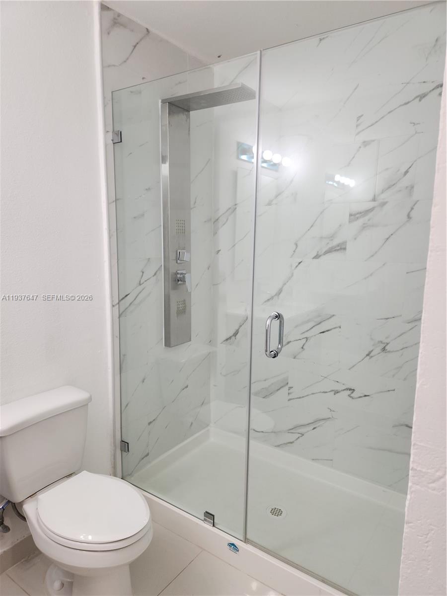 13937 Southwest 259th Street Homestead, FL 33032 - Photo 11 of 17 a white toilet next to a bathroom