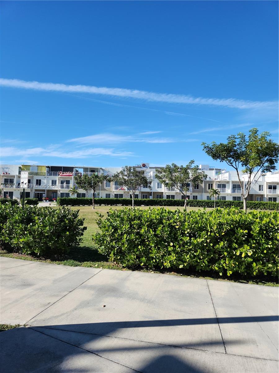 13937 Southwest 259th Street Homestead, FL 33032 - Photo 2 of 17 a view of a garden with an outdoor space