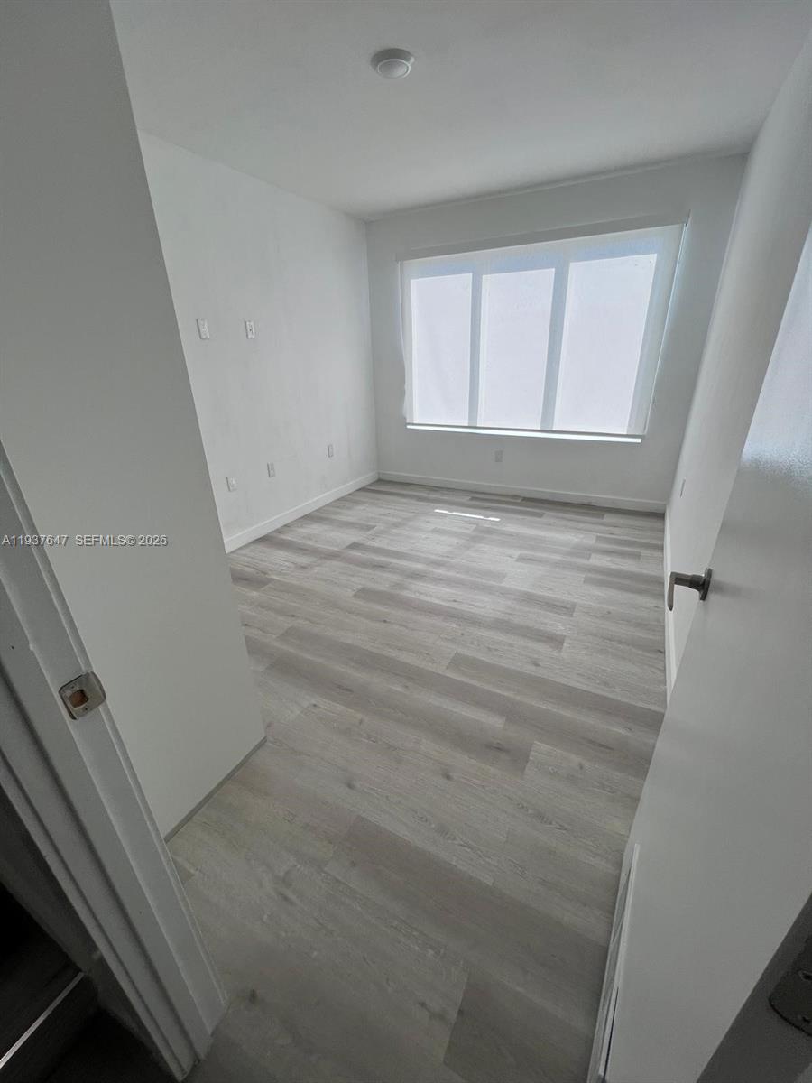 13937 Southwest 259th Street Homestead, FL 33032 - Photo 8 of 17 a view of empty room with window