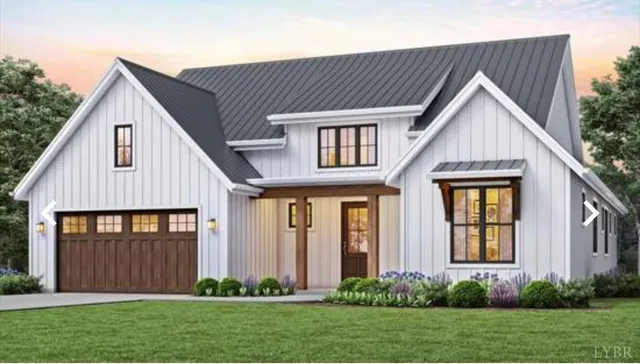 a view of a house with brick walls and a yard with potted plants