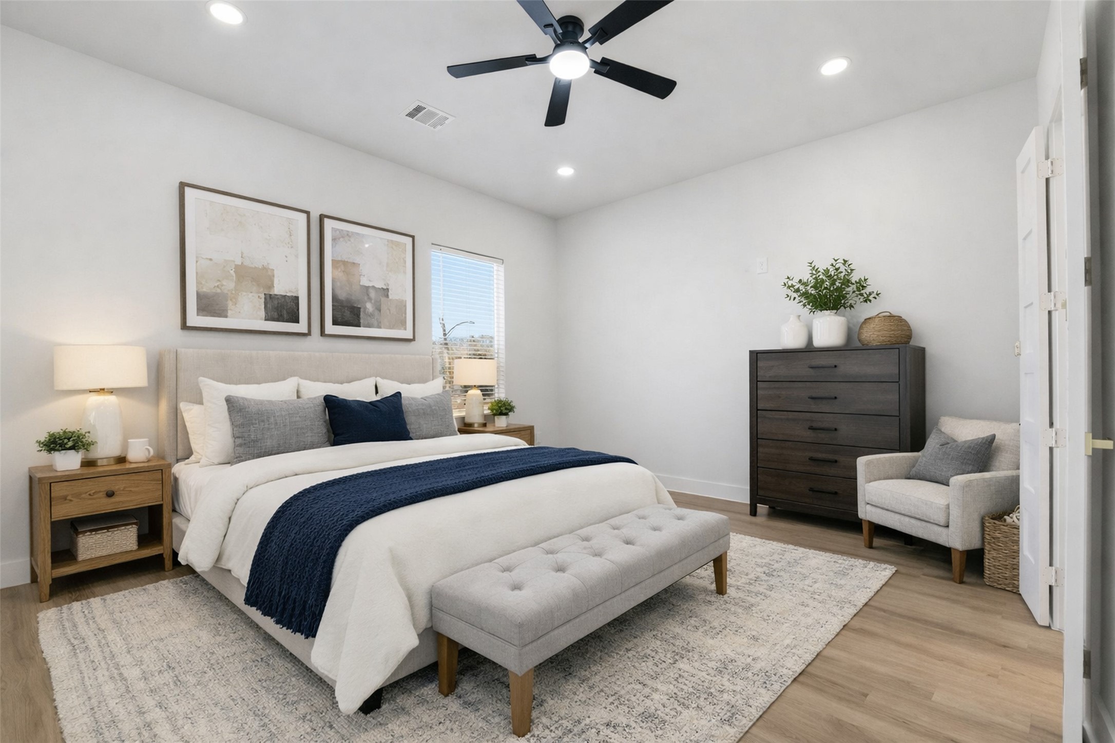 4208 Fox Street Houston, TX 77003 - Photo 20 of 43 a spacious bedroom with a bed and a couch