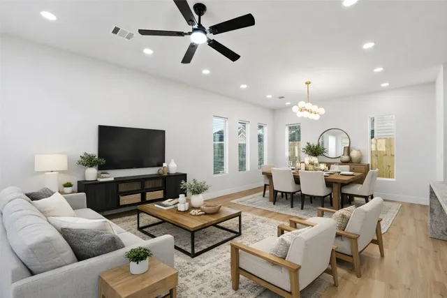 a view of a hallway with wooden floor and a window