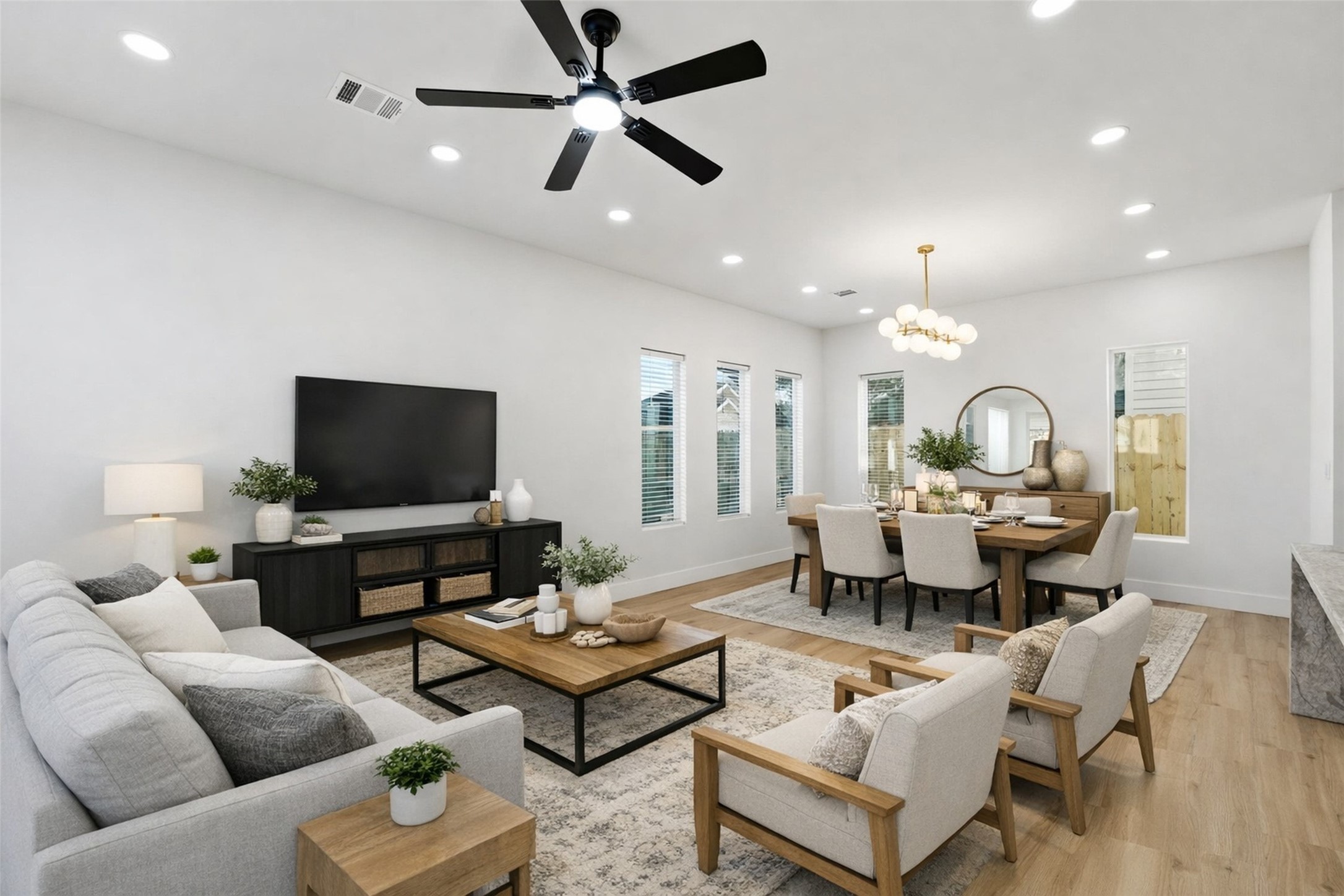 4208 Fox Street Houston, TX 77003 - Photo 8 of 43 a living room with furniture kitchen view and a flat screen tv