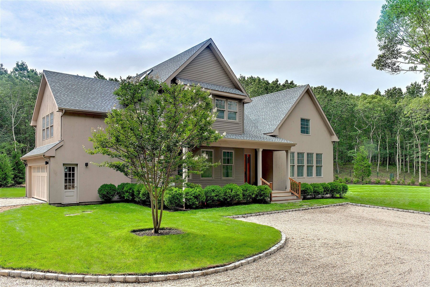 114 Three Mile Harbor Road East Hampton, NY 11937 - Photo 1 of 14 a front view of a house with a yard and trees