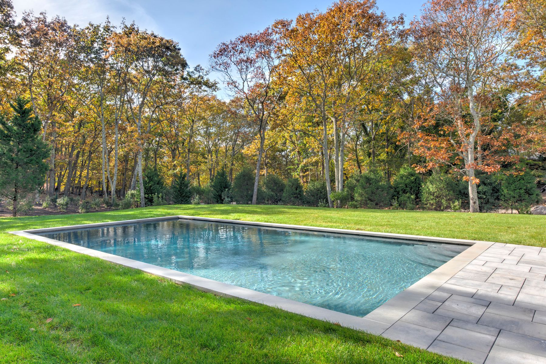 114 Three Mile Harbor Road East Hampton, NY 11937 - Photo 12 of 14 a view of a swimming pool with a yard