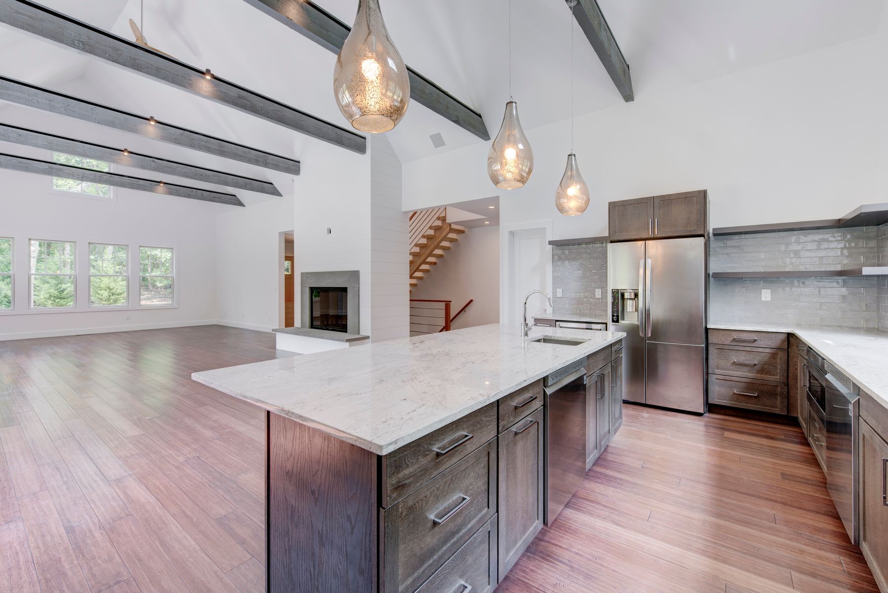 114 Three Mile Harbor Road East Hampton, NY 11937 - Photo 2 of 14 a kitchen with stainless steel appliances granite countertop a sink a stove and a wooden floors