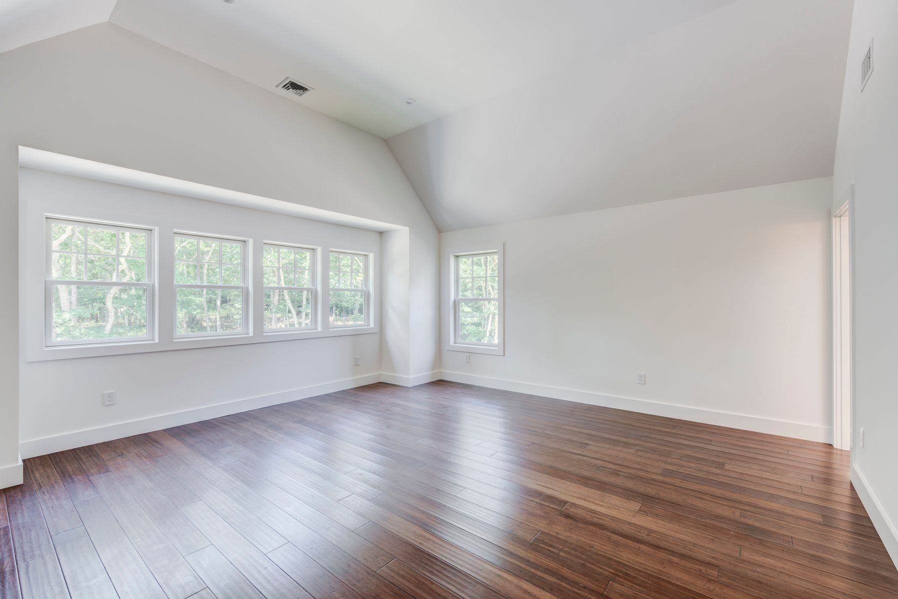 114 Three Mile Harbor Road East Hampton, NY 11937 - Photo 7 of 14 an empty room with wooden floor and windows