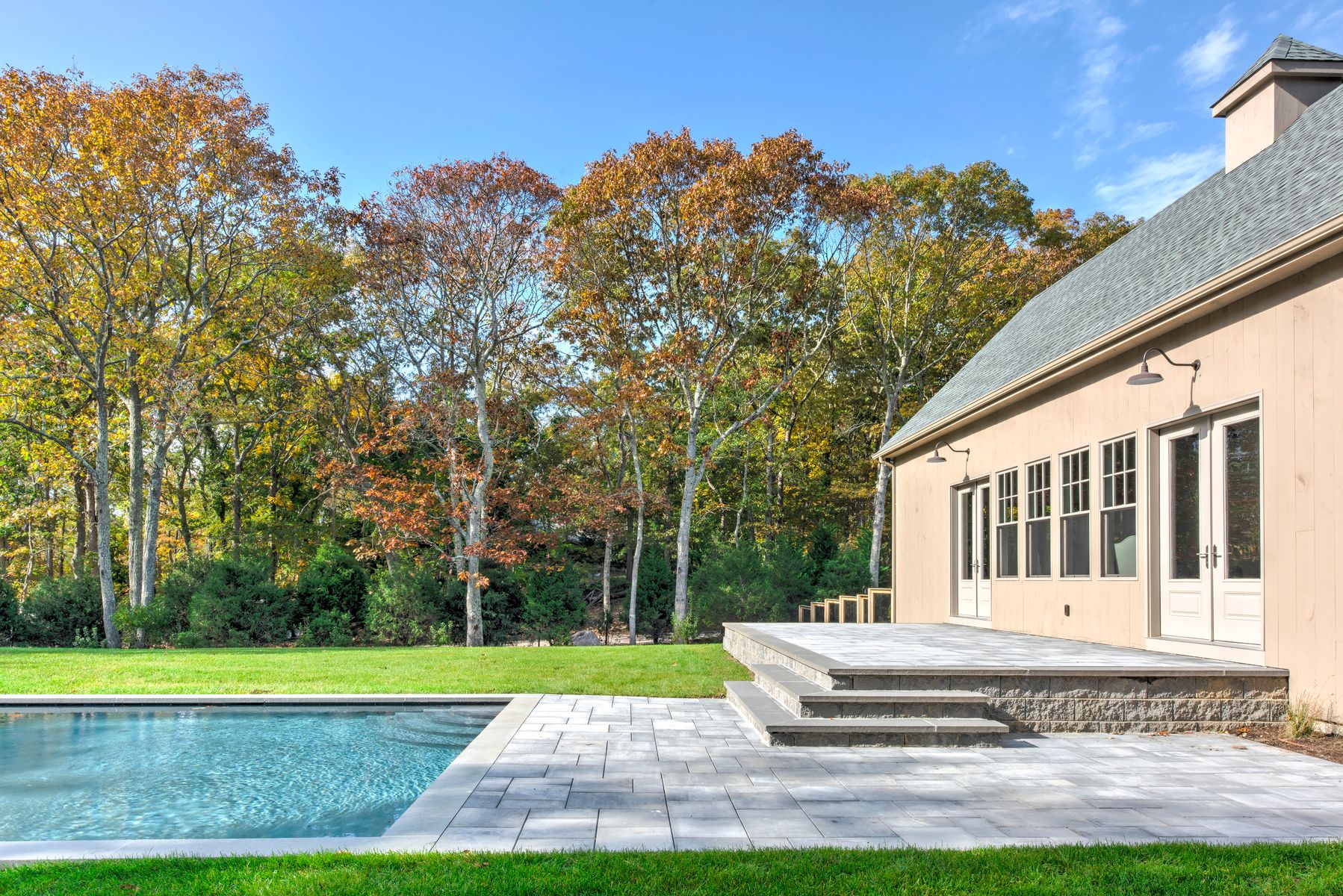 114 Three Mile Harbor Road East Hampton, NY 11937 - Photo 10 of 14 a view of a house with a backyard and a patio
