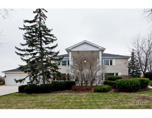 8220 Ridgepoint Drive Burr Ridge, IL 60527 - Photo 1 of 16 a front view of a house with a yard