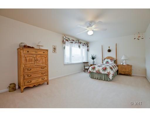 8220 Ridgepoint Drive Burr Ridge, IL 60527 - Photo 11 of 16 a bedroom with furniture and a window