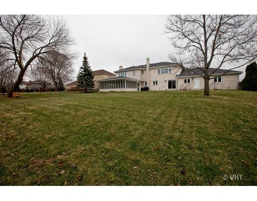 8220 Ridgepoint Drive Burr Ridge, IL 60527 - Photo 16 of 16 a front view of a house with a garden