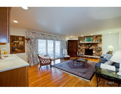 8220 Ridgepoint Drive Burr Ridge, IL 60527 - Photo 6 of 16 a living room with furniture and a fireplace
