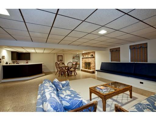 8220 Ridgepoint Drive Burr Ridge, IL 60527 - Photo 8 of 16 a living room with furniture a rug and a flat screen tv