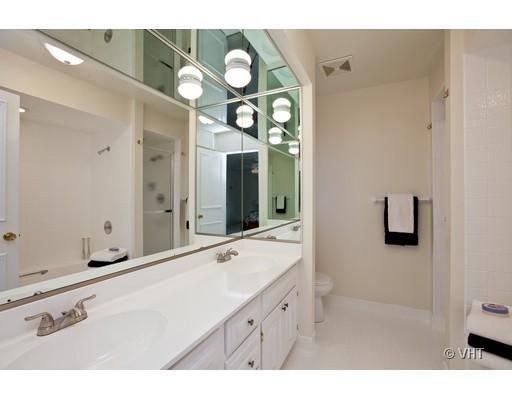 8220 Ridgepoint Drive Burr Ridge, IL 60527 - Photo 10 of 16 a bathroom with a sink and a mirror with bathtub
