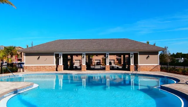swimming pool view with a outdoor seating