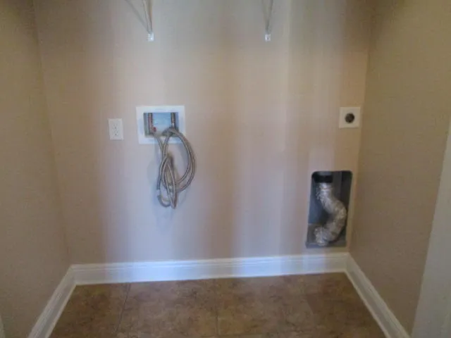 a view of a room with wooden floor and window