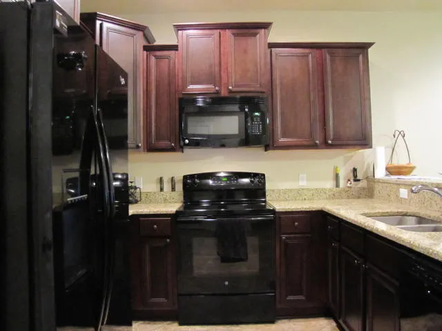 a kitchen with a sink and a stove
