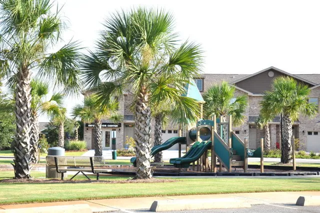 a view of a houses with palm trees