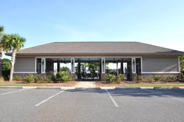a view of a patio with swimming pool table and chairs