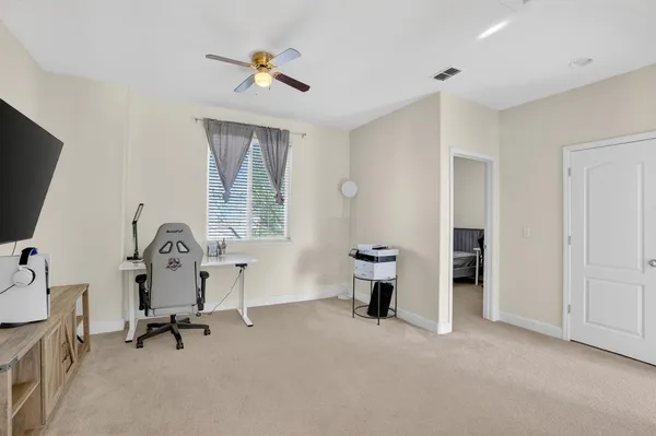 a view of a livingroom with furniture and a window