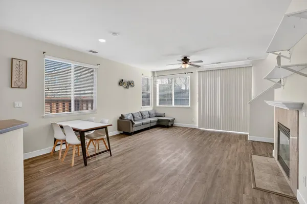a view of a livingroom with furniture and a window