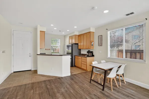 a kitchen with a table and chairs in it
