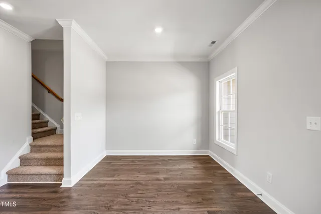 a view of entryway with stairs and wooden floor