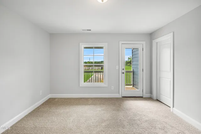 an empty room with windows