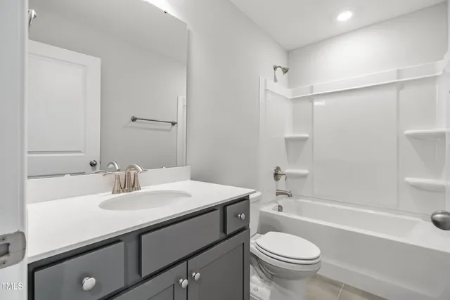 a bathroom with a sink a toilet and a bathtub