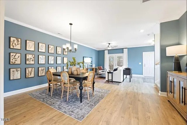 a view of a living room a window and wooden floor