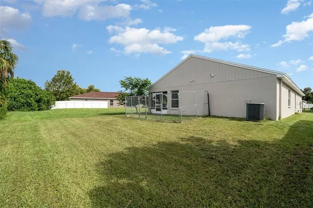 a house view with swimming pool in front of it