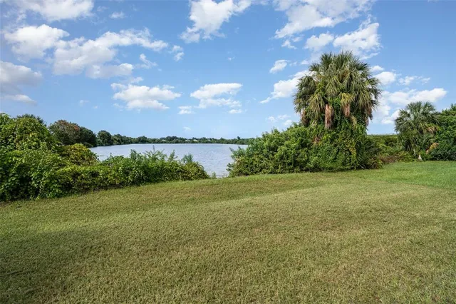 a view of a field with an trees