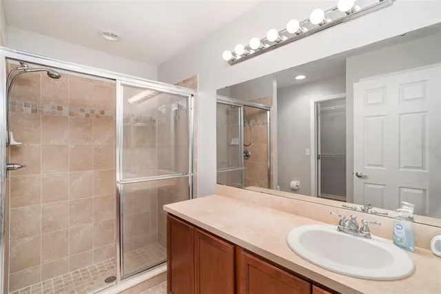 a bathroom with a sink double vanity and a mirror