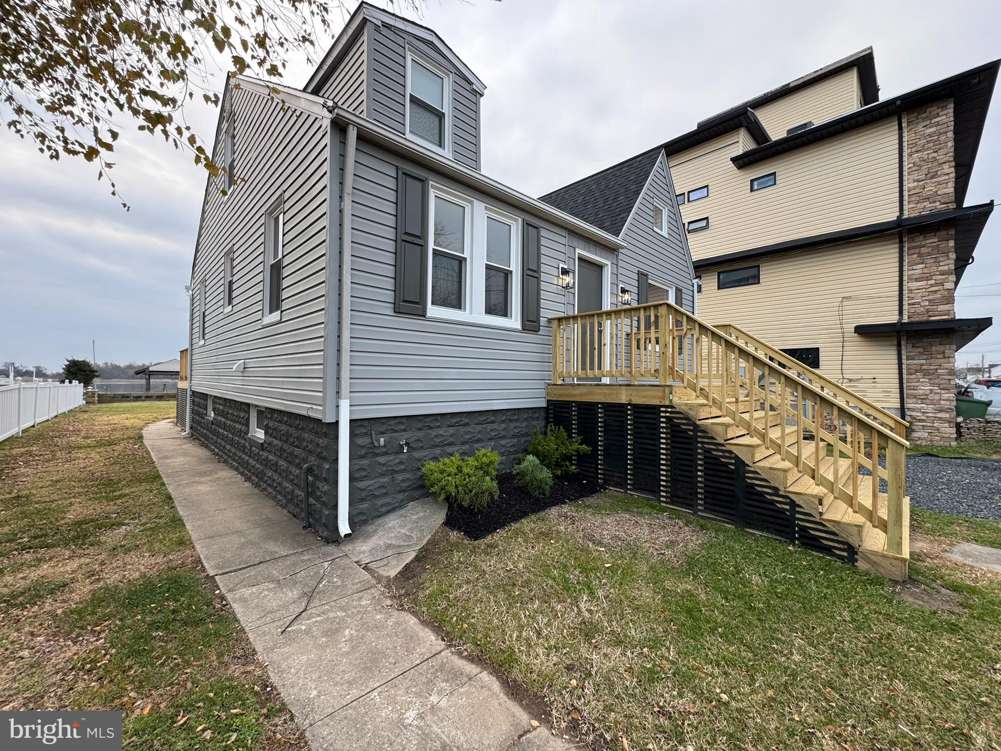 9135 Cuckold Point Road Sparrows Point, MD 21219 - Photo 11 of 53 a view of a house with a yard