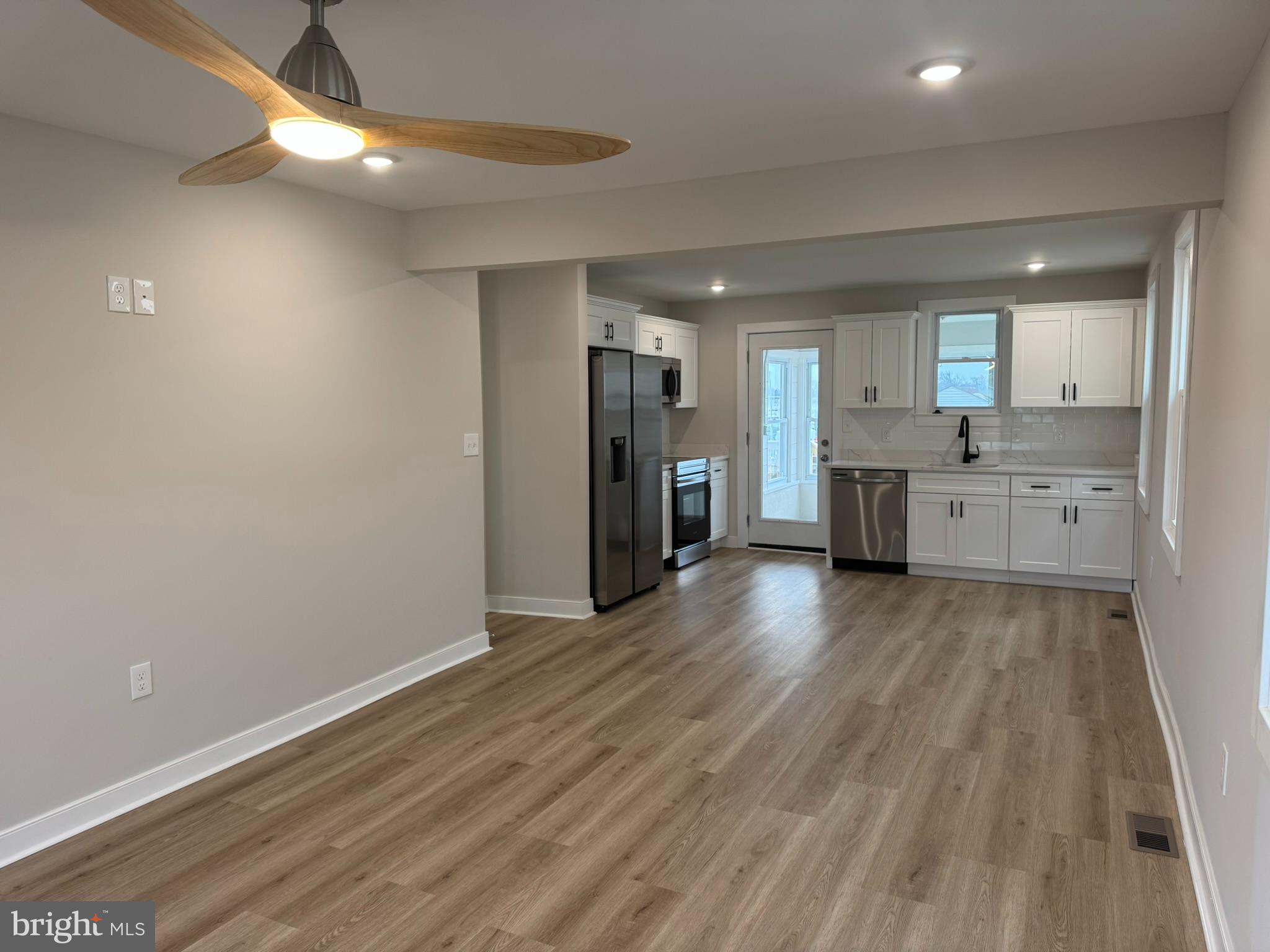 9135 Cuckold Point Road Sparrows Point, MD 21219 - Photo 20 of 53 a view of a kitchen with a sink and a refrigerator