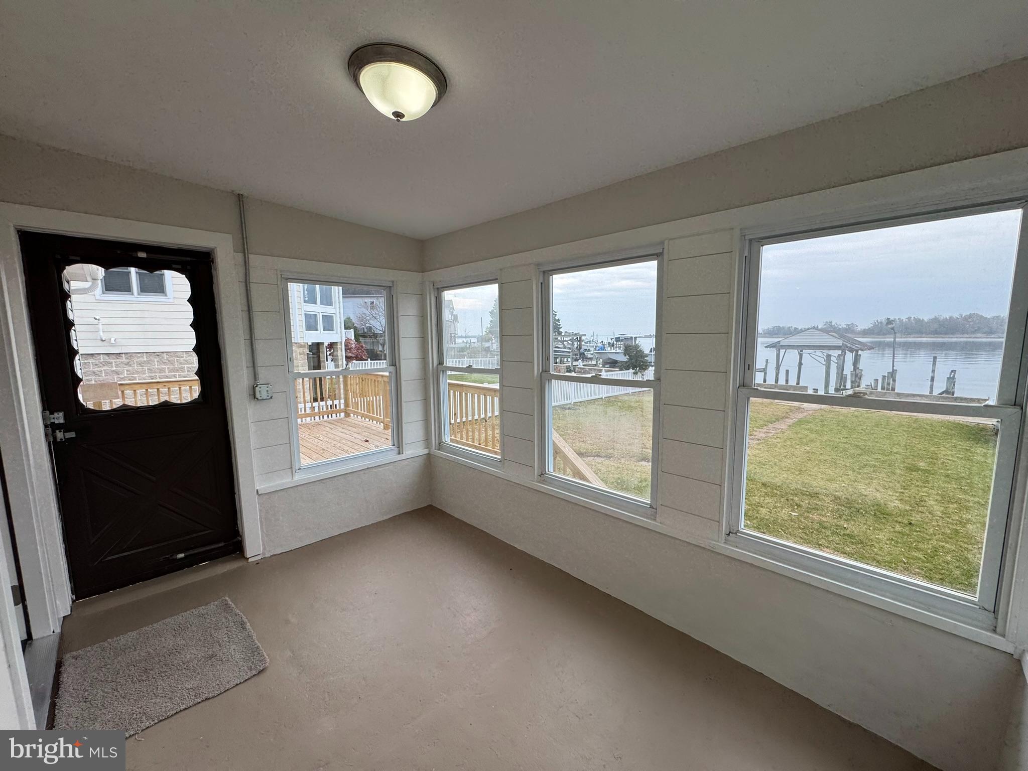 9135 Cuckold Point Road Sparrows Point, MD 21219 - Photo 25 of 53 a view of an empty room with a window