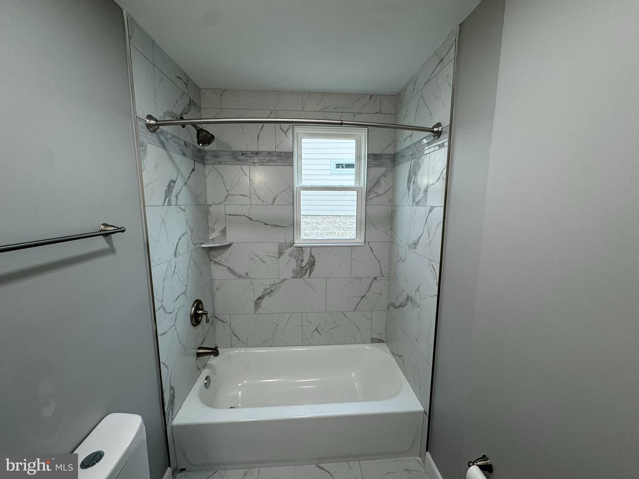 9135 Cuckold Point Road Sparrows Point, MD 21219 - Photo 32 of 53 a bathroom with a bathtub and a shower