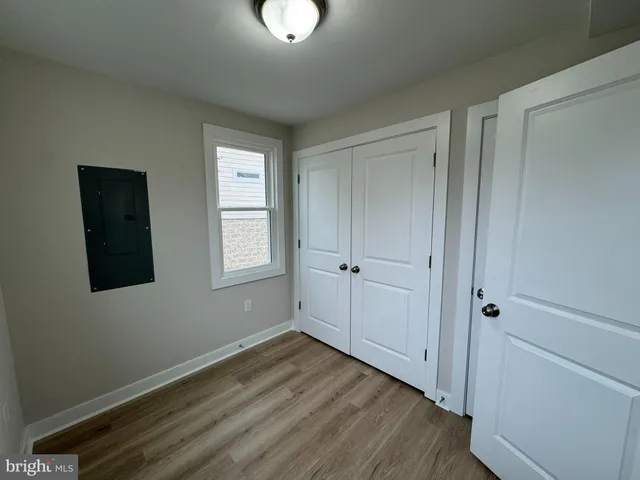 a view of a livingroom with wooden floor