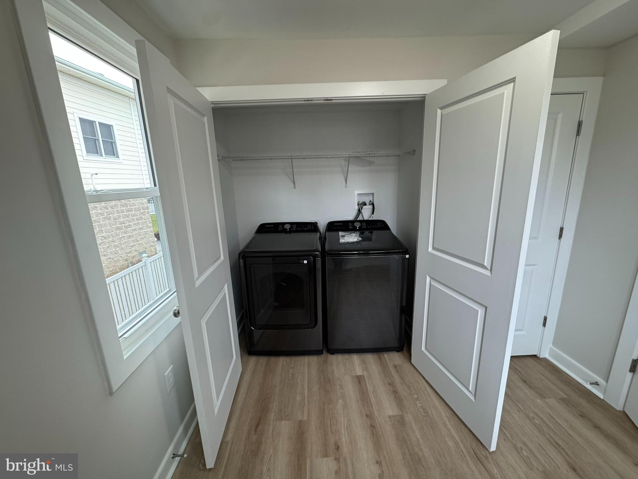 9135 Cuckold Point Road Sparrows Point, MD 21219 - Photo 37 of 53 a view of a closet area with furniture and wooden floor