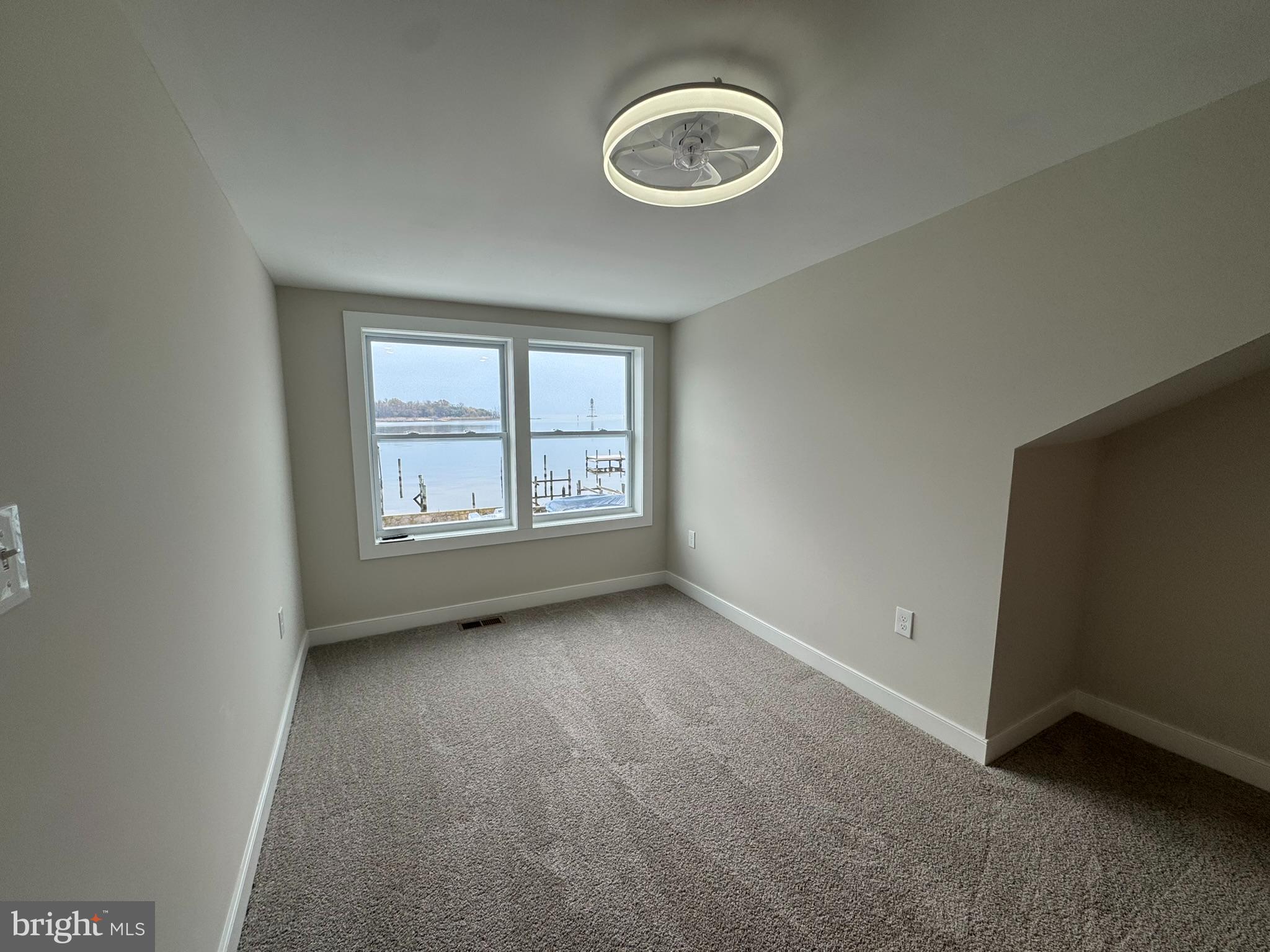 9135 Cuckold Point Road Sparrows Point, MD 21219 - Photo 41 of 53 an empty room with a window