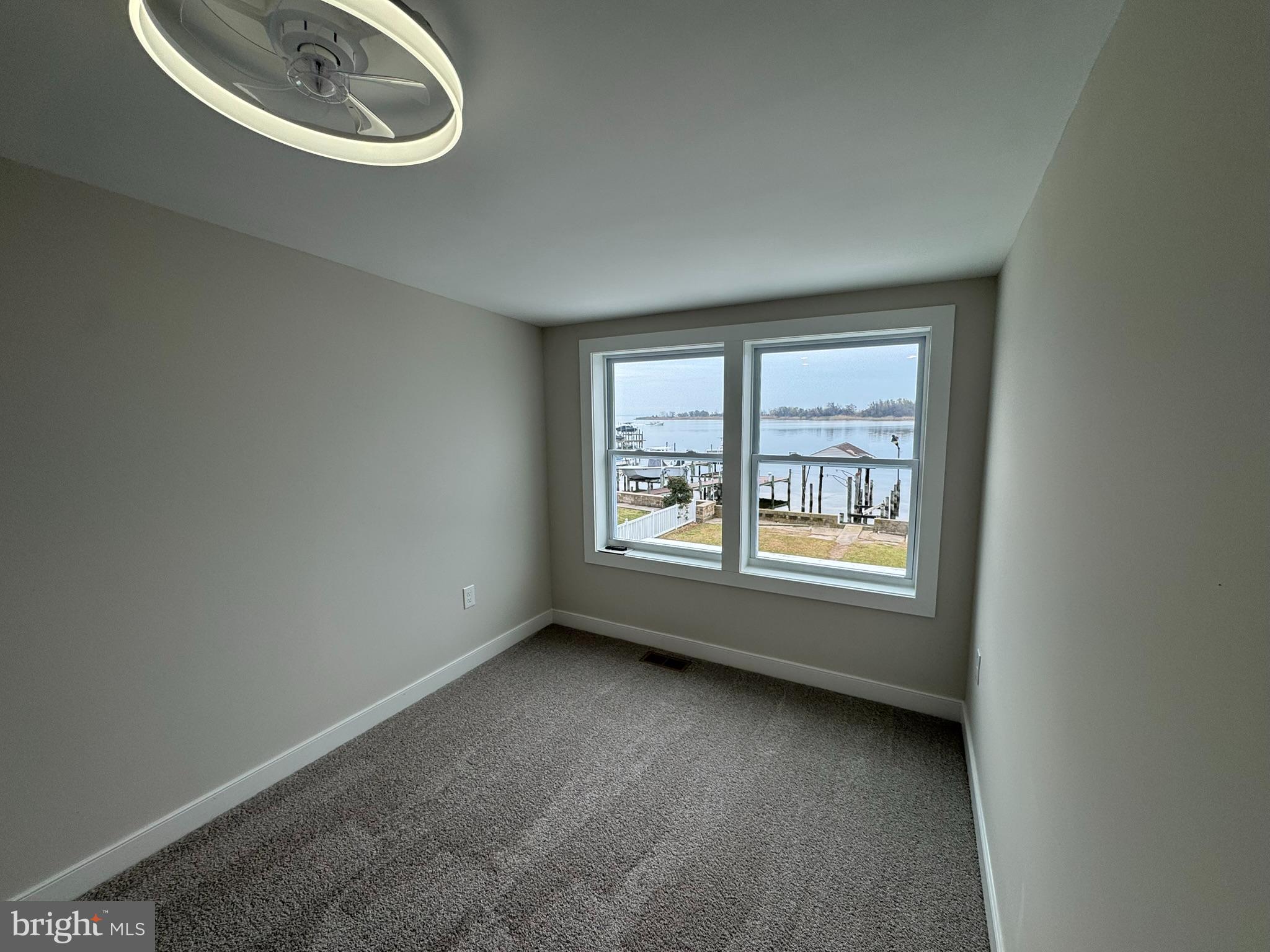 9135 Cuckold Point Road Sparrows Point, MD 21219 - Photo 43 of 53 an empty room with a window