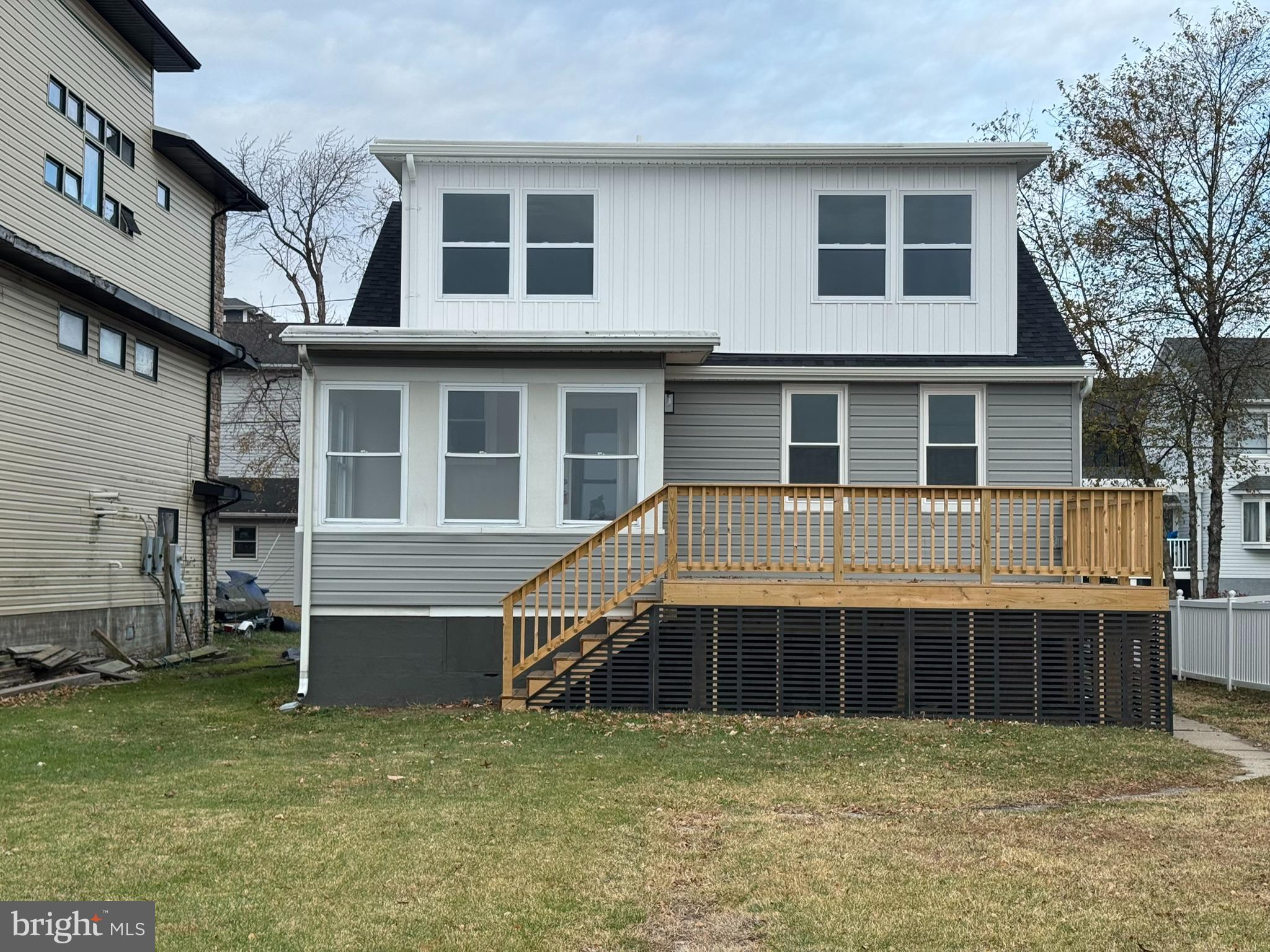 9135 Cuckold Point Road Sparrows Point, MD 21219 - Photo 8 of 53 a front view of a house with a yard