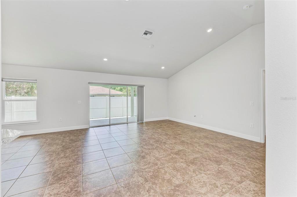 105 Dartmouth Road Venice, FL 34293 - Photo 14 of 100 an empty room with windows and entrance