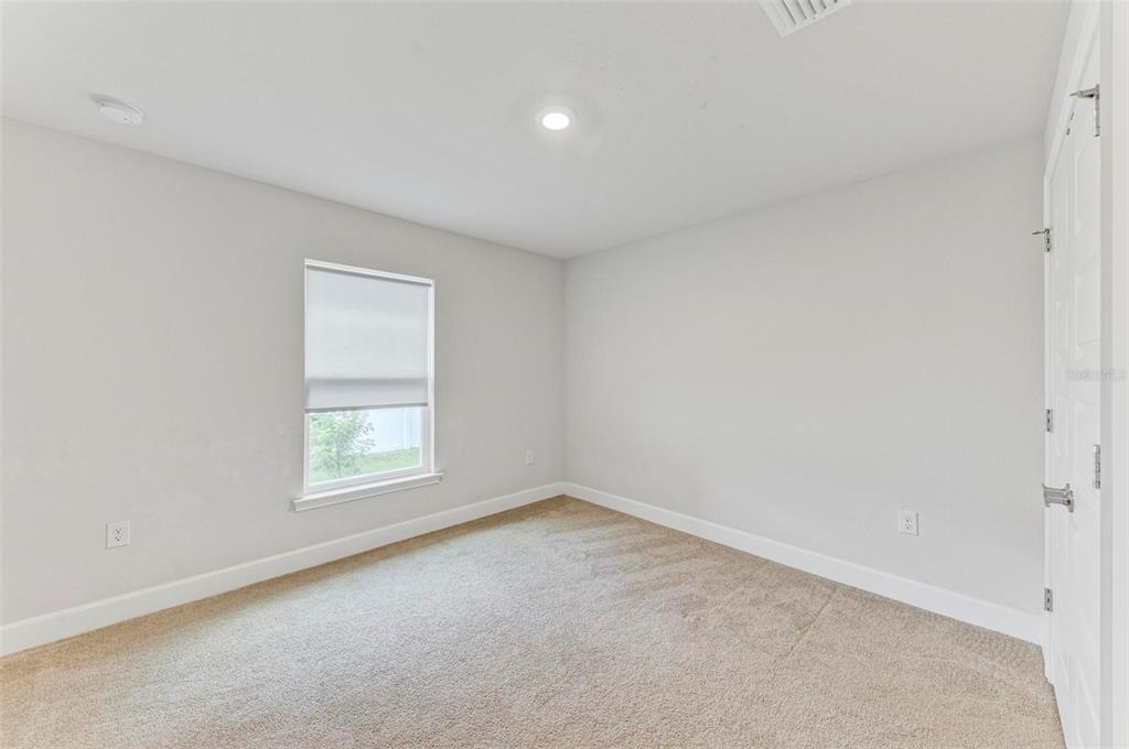 105 Dartmouth Road Venice, FL 34293 - Photo 25 of 100 an empty room with a window