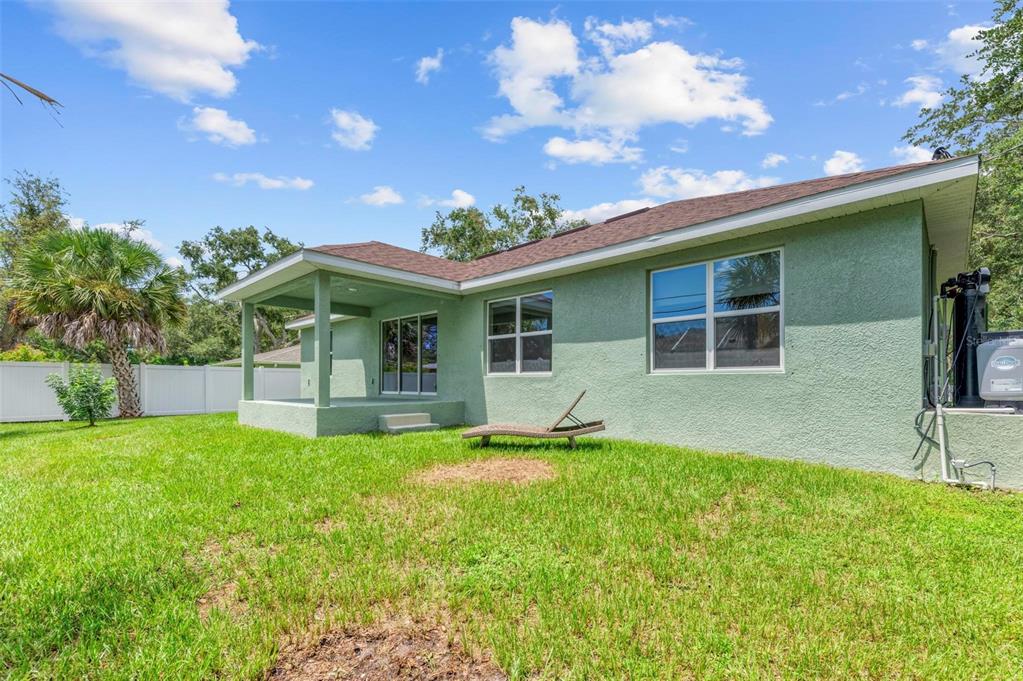 105 Dartmouth Road Venice, FL 34293 - Photo 43 of 100 a view of a house with a yard and sitting area