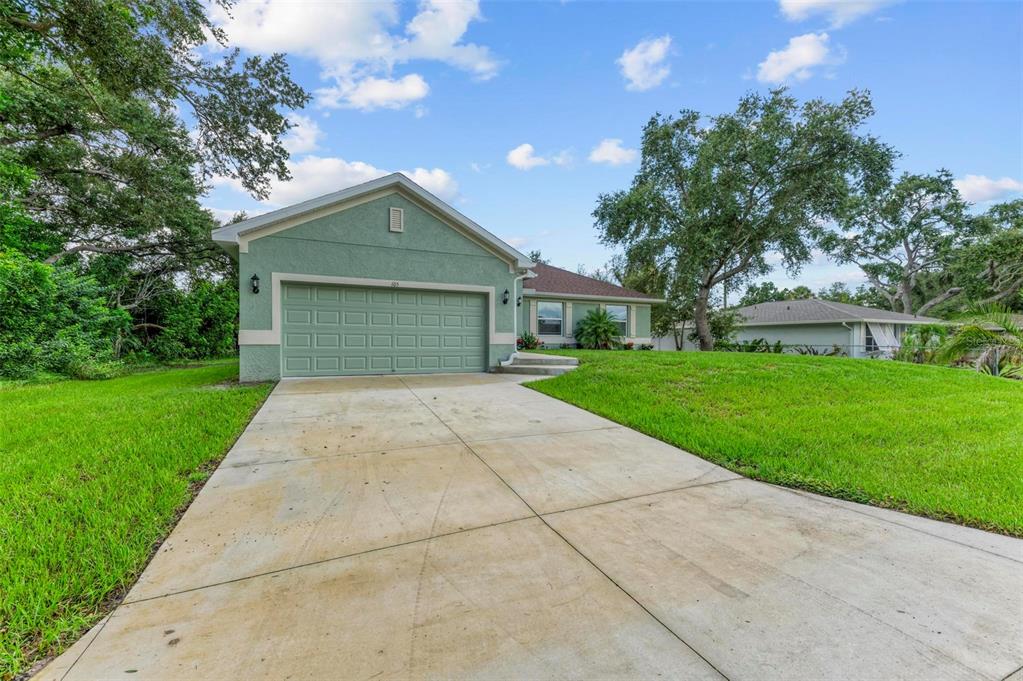 105 Dartmouth Road Venice, FL 34293 - Photo 54 of 100 a front view of house with yard and green space