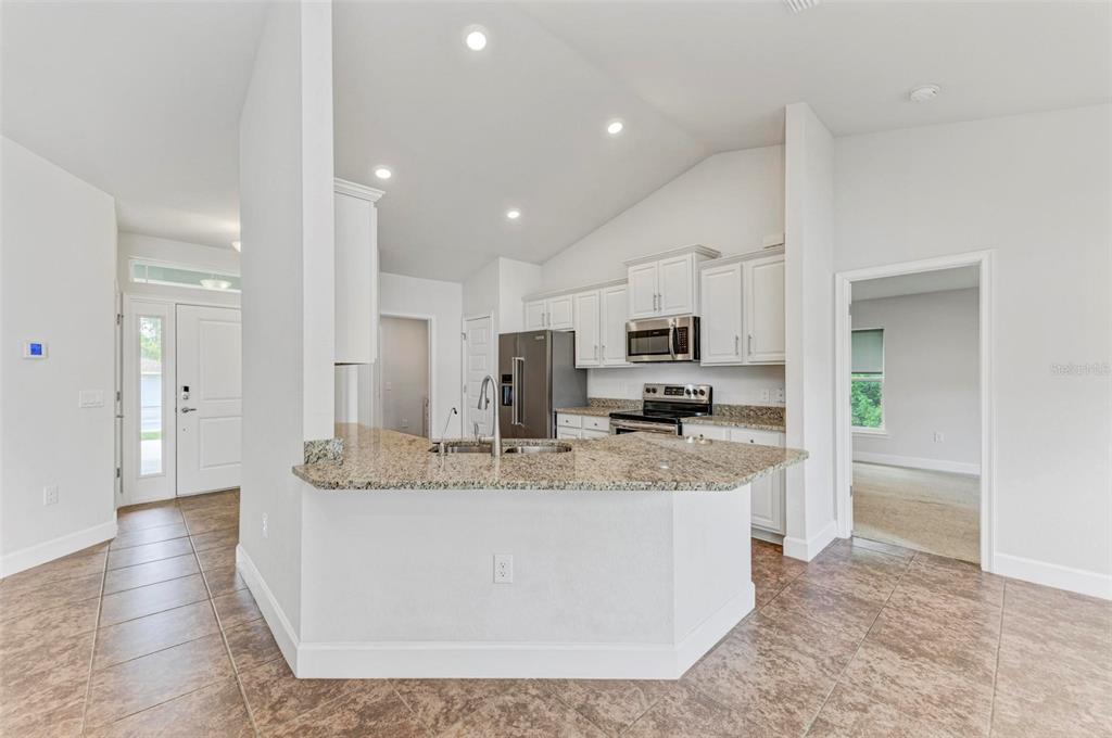 105 Dartmouth Road Venice, FL 34293 - Photo 10 of 100 a large kitchen with stainless steel appliances granite countertop a large counter top and a refrigerator