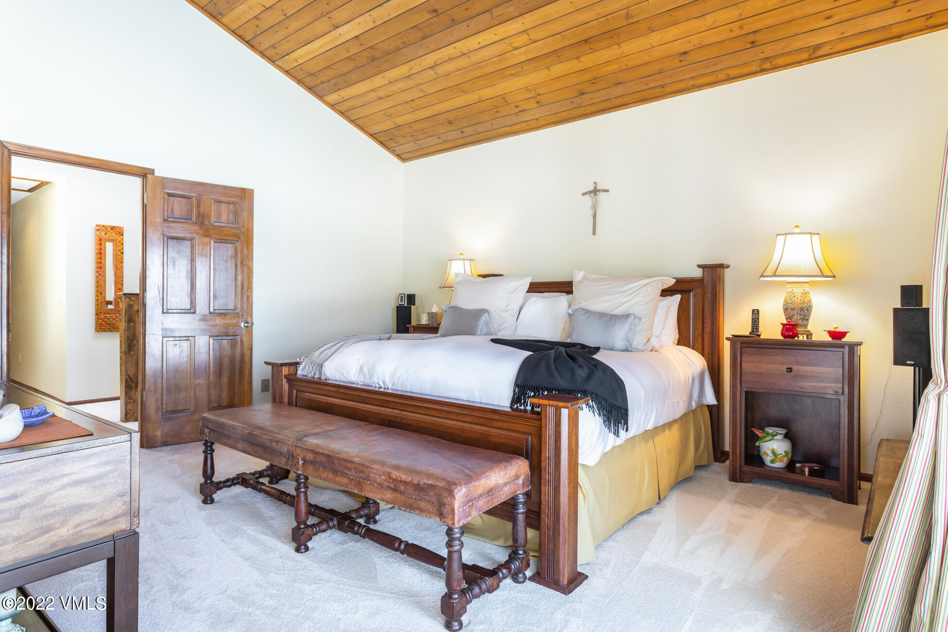 231 Rawhide Road Edwards, CO 81632 - Photo 18 of 35 a bedroom with a bed and a dresser next to a window